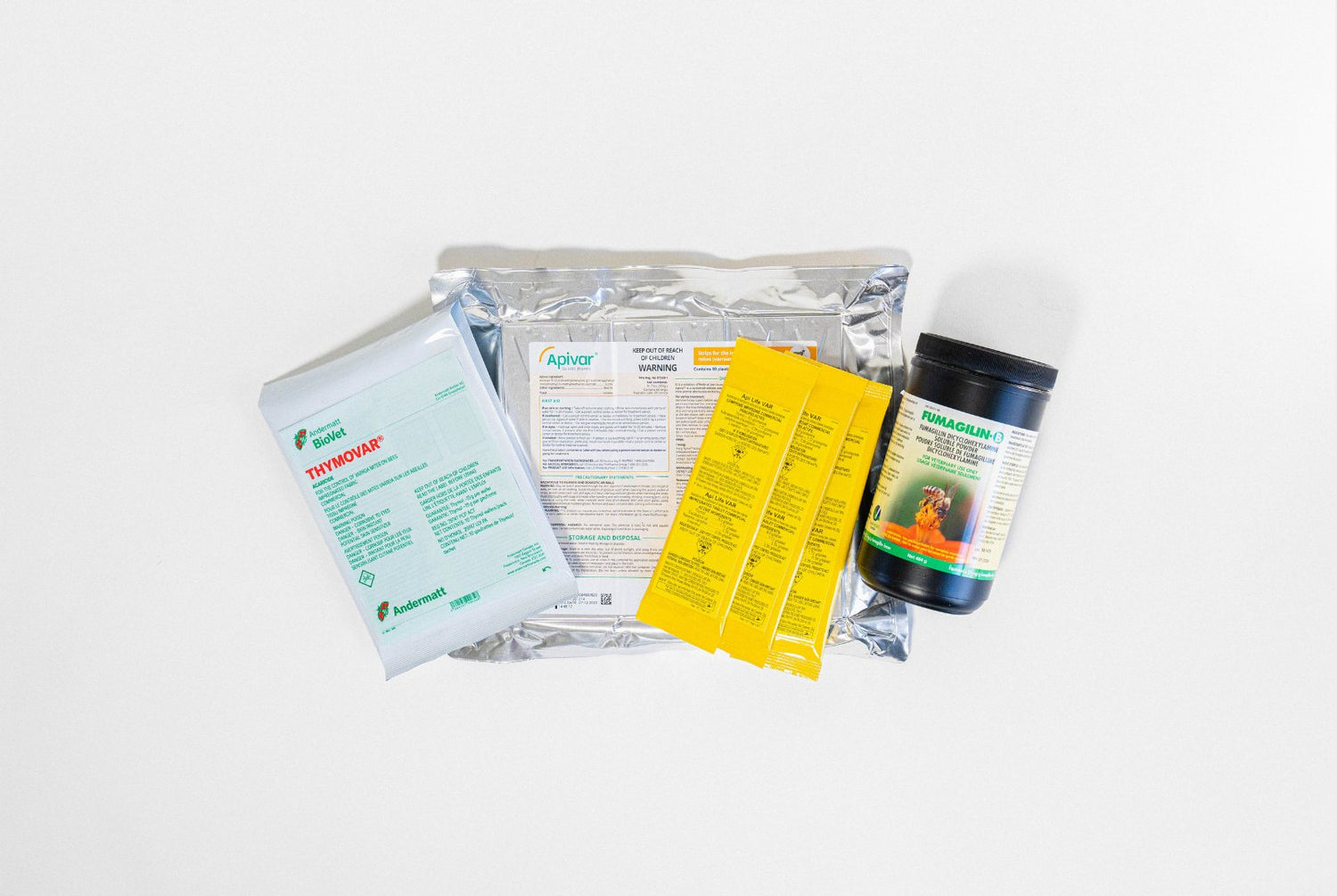 Four packages of Bee Health products, including Thymovar, Apivar, and Fumagilin-O, displayed on a white background
