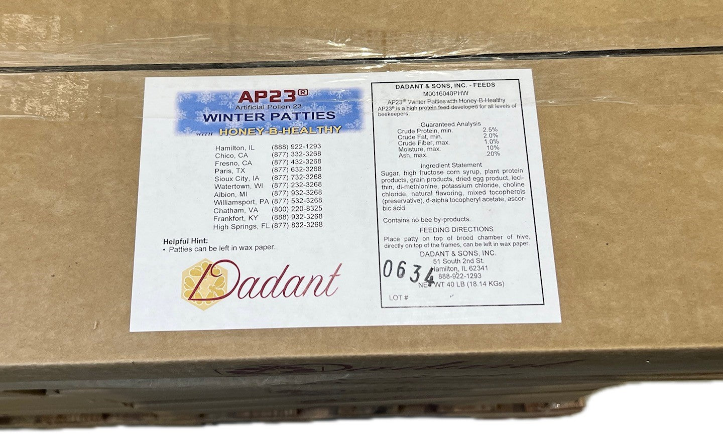A label on a cardboard box showing the 'APR 23 Winter Patties' product details and the brand name 'Dadant'.