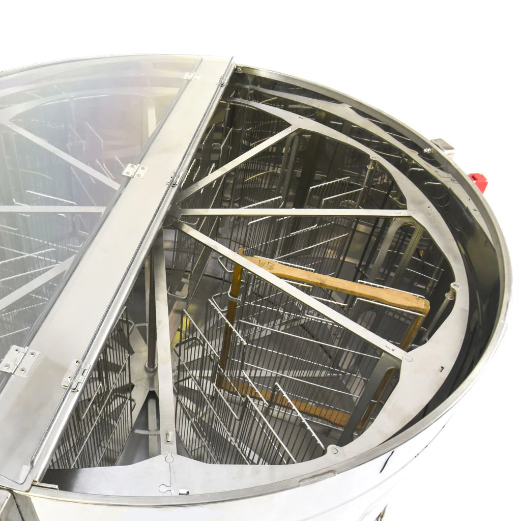 A KONIGIN motorized honey extractor made of stainless steel, with the lid open to display the interior on a white background