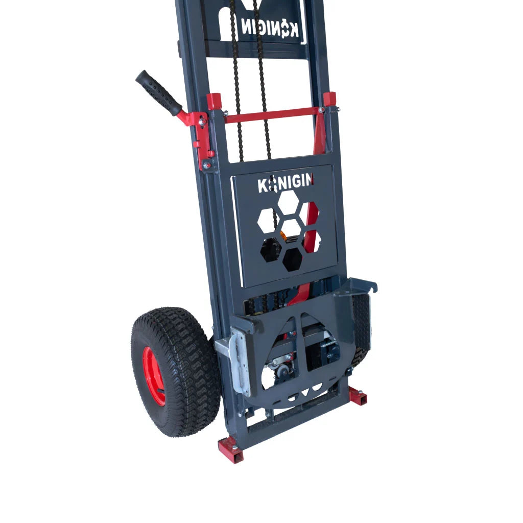 A Konigin industrial pallet jack with a dark gray steel frame, black wheels, and red accents on a white background
