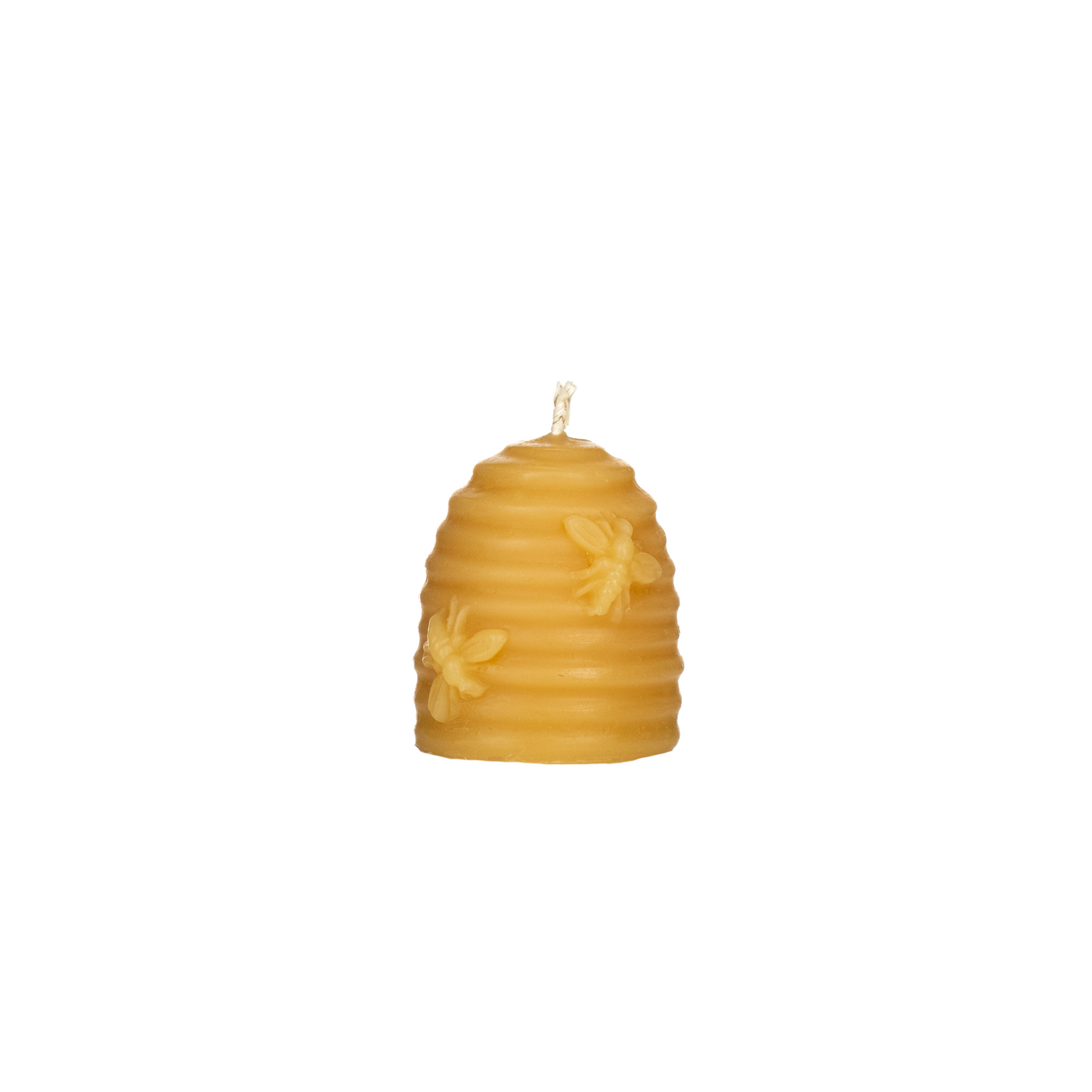 Beeswax candle shaped like a beehive on a white background