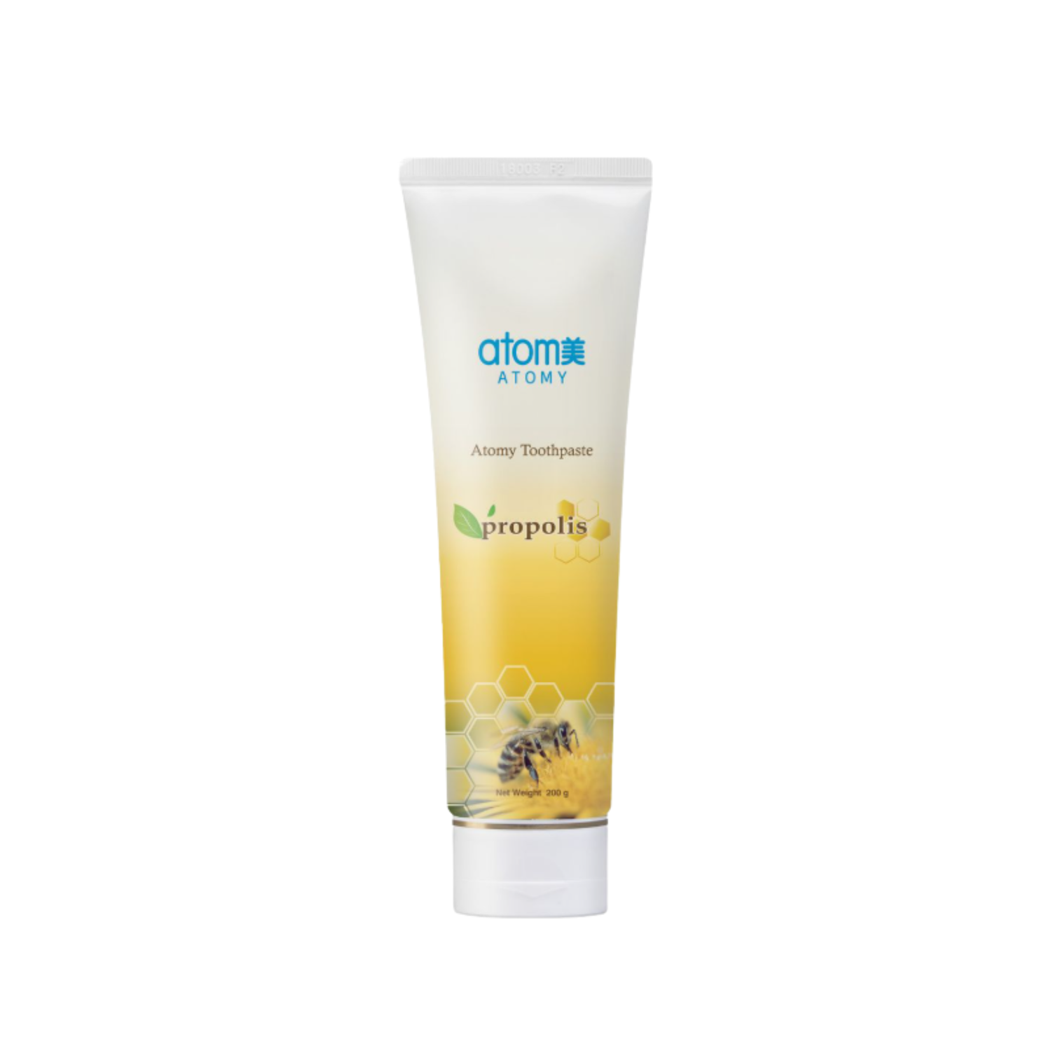 Tube of Atomy Propolis Toothpaste standing upright. The design features a white-to-yellow gradient with honeycomb graphics and a close-up image of a honeybee on a flower near the bottom. The product name and propolis leaf icon are displayed on the front.