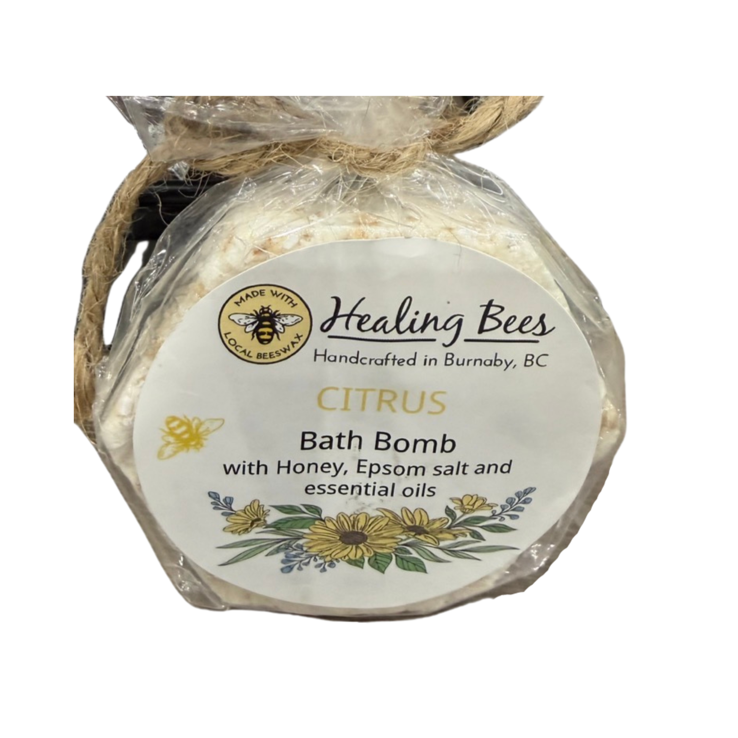 Bath bomb with 'Healing Bees' label on a white background