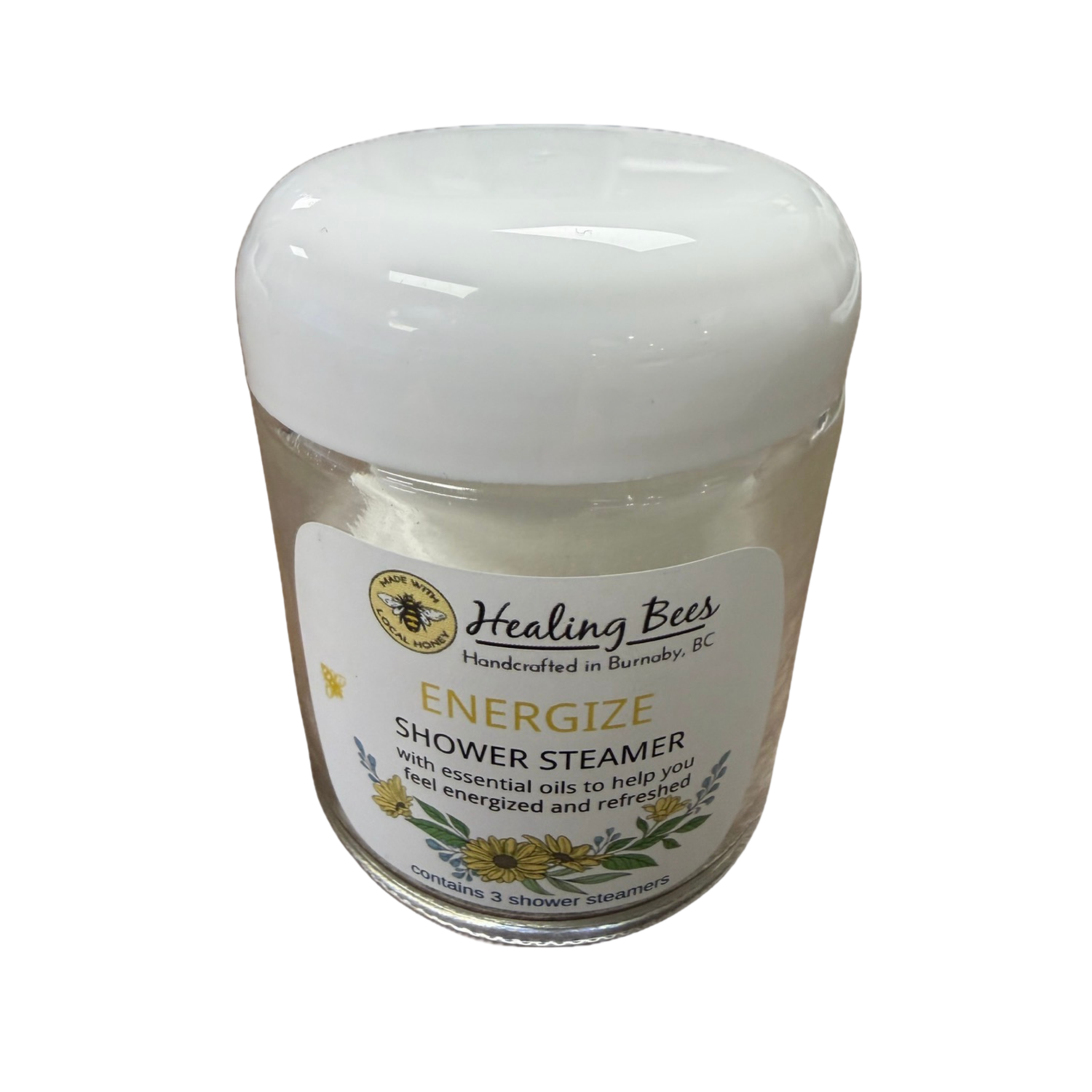 Healing Bees shower steamer with a white lid on a white background