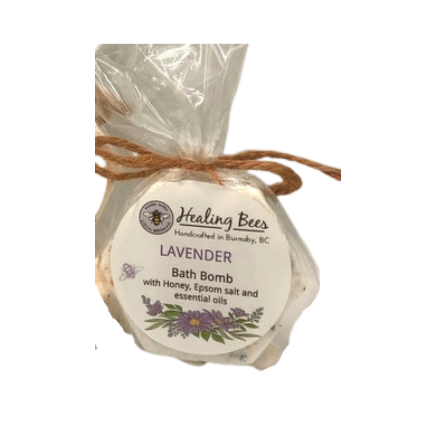 Lavender bath bomb with packaging labeled 'Healing Bees' on a white background