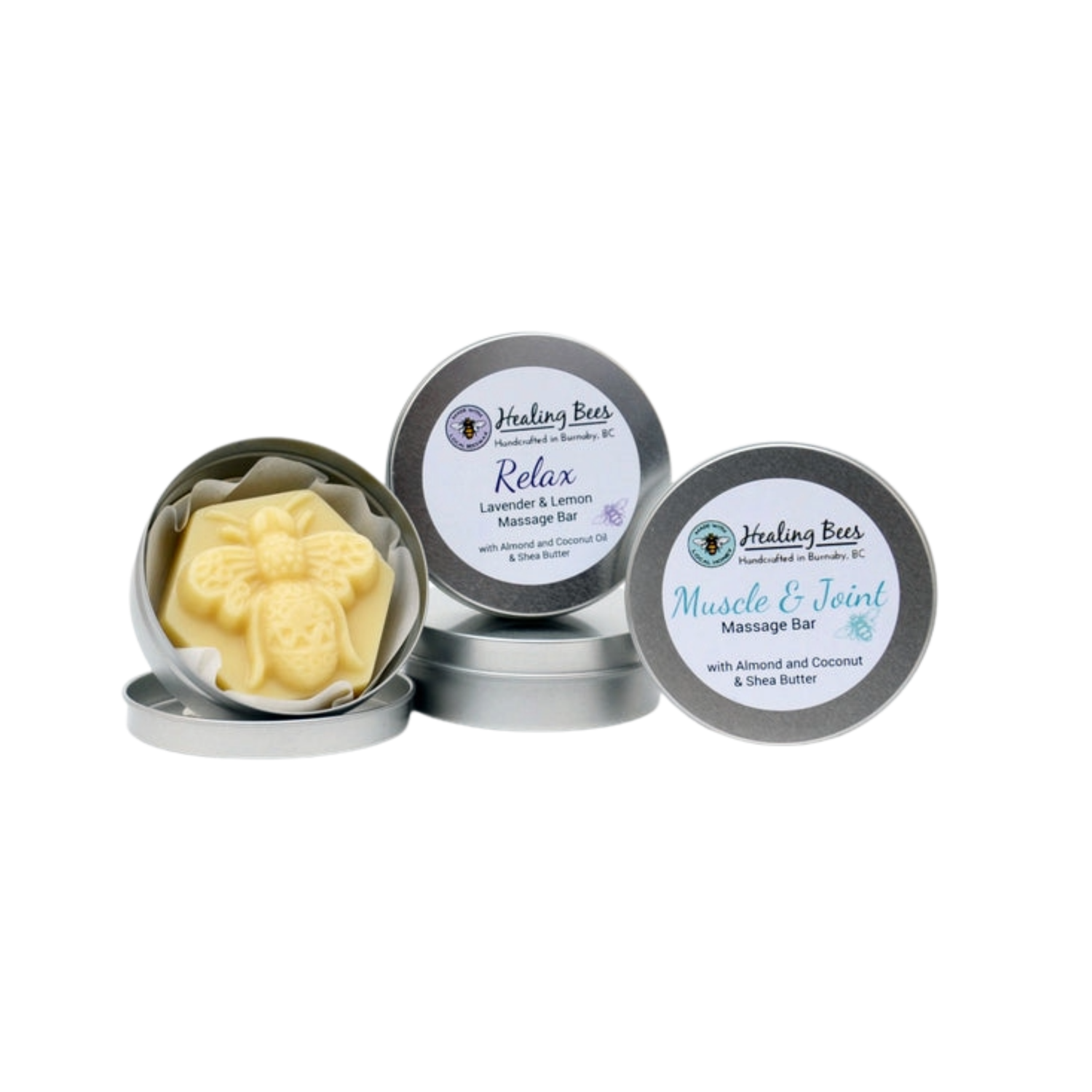 Healing Bees massage bars in metal tins on a white background