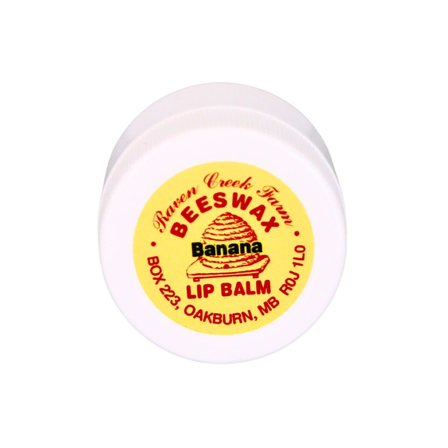 A white, plastic lip balm jar filled with Raven Creek Farm's Beeswax Lip Balm, flavoured as