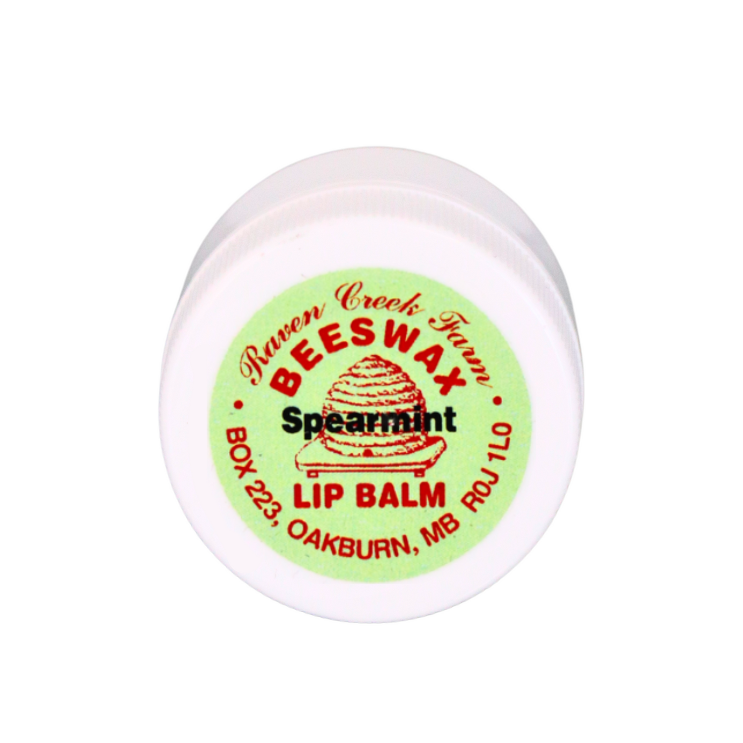 A white, plastic lip balm jar filled with Raven Creek Farm's Beeswax Lip Balm, flavoured as