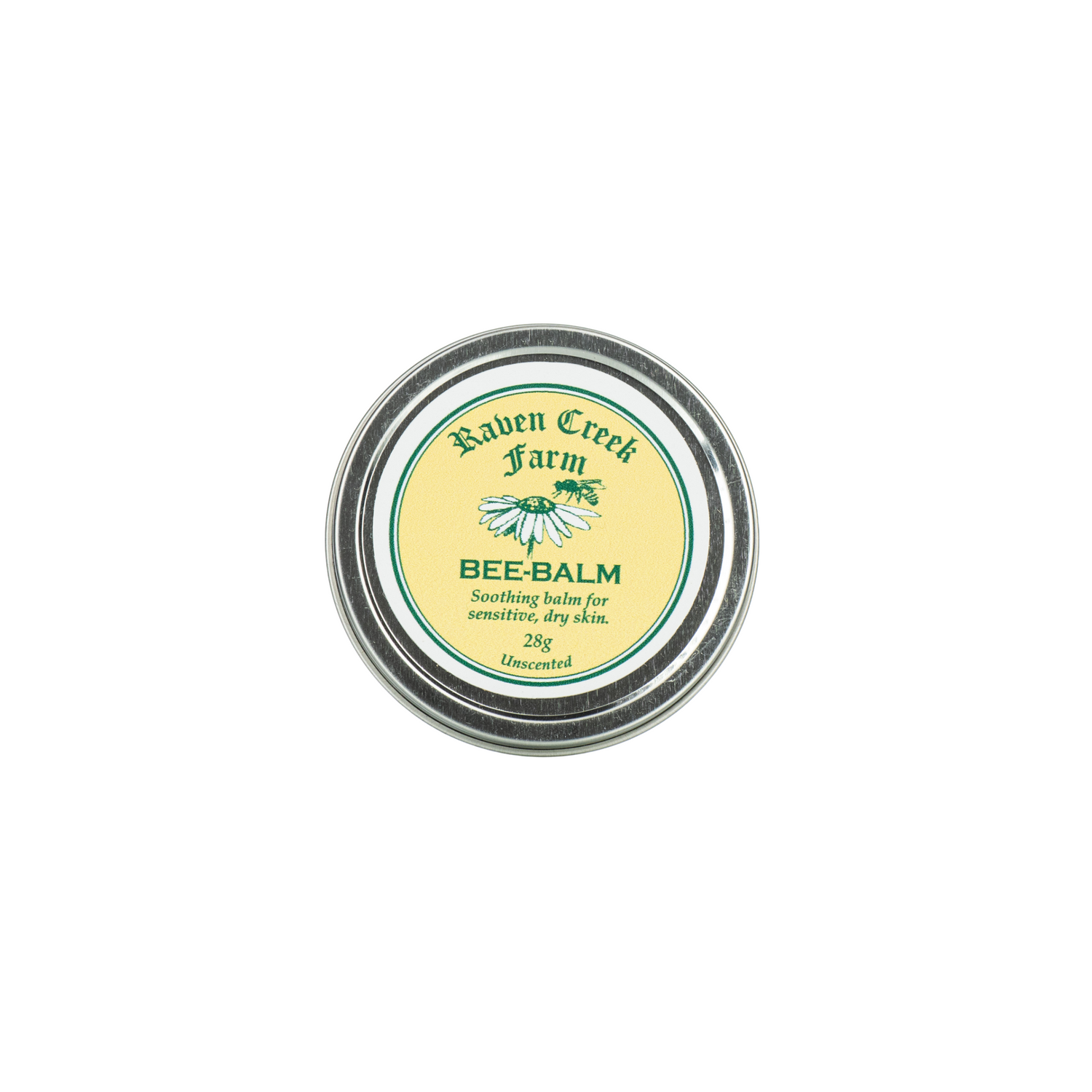 A tin container labeled 'Raven Creek Farm Bee-Balm' with a green and yellow color scheme, indicating it is a soothing balm for sensitive, dry skin, on a white background