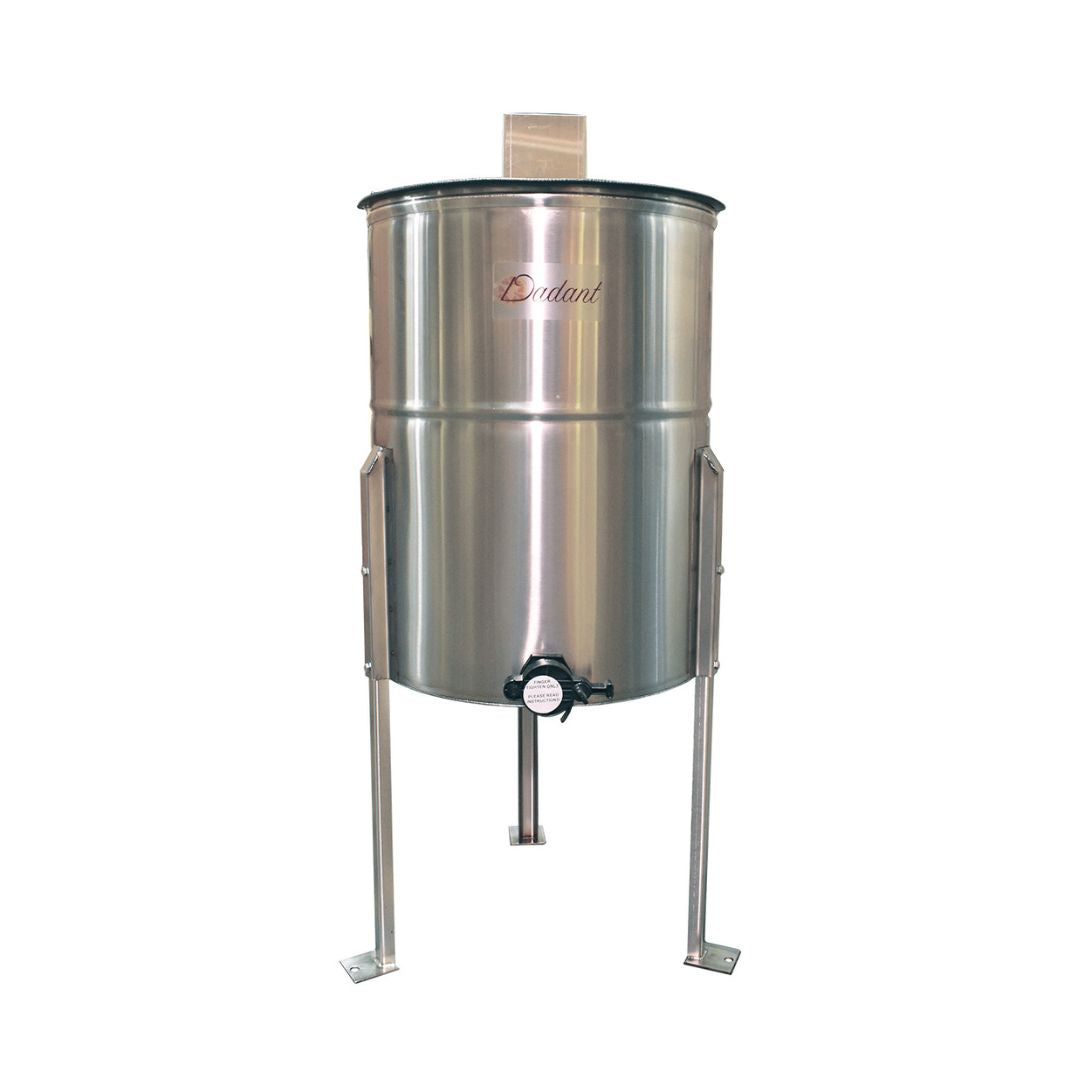 A stainless-steel hand-powered 4-frame honey extractor with sturdy legs and a 1.5-inch honey gate.