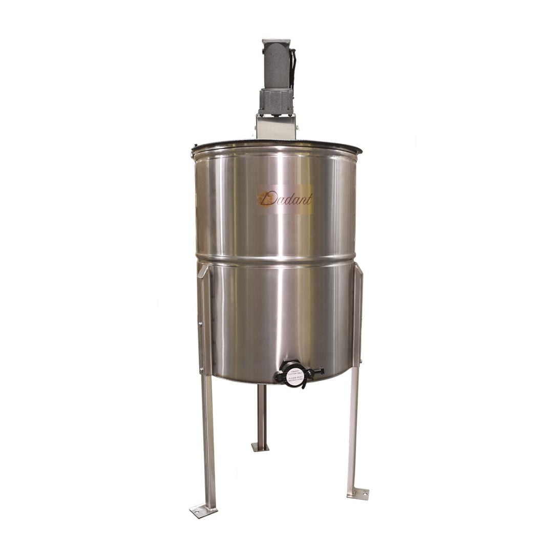 A stainless steel power-driven 4-frame honey extractor with sturdy legs and a 1 1/2