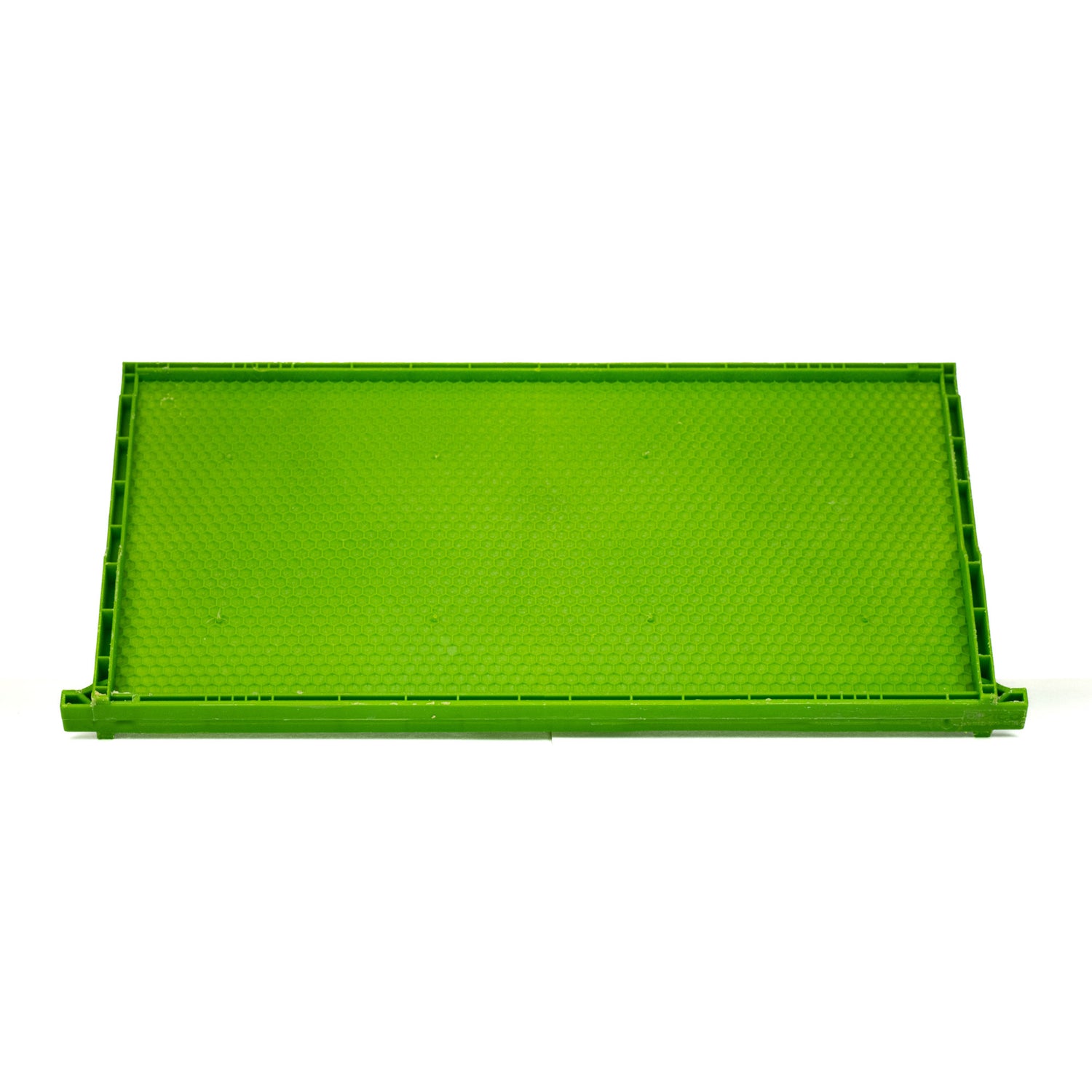 A green wax-coated drone frame for beehives