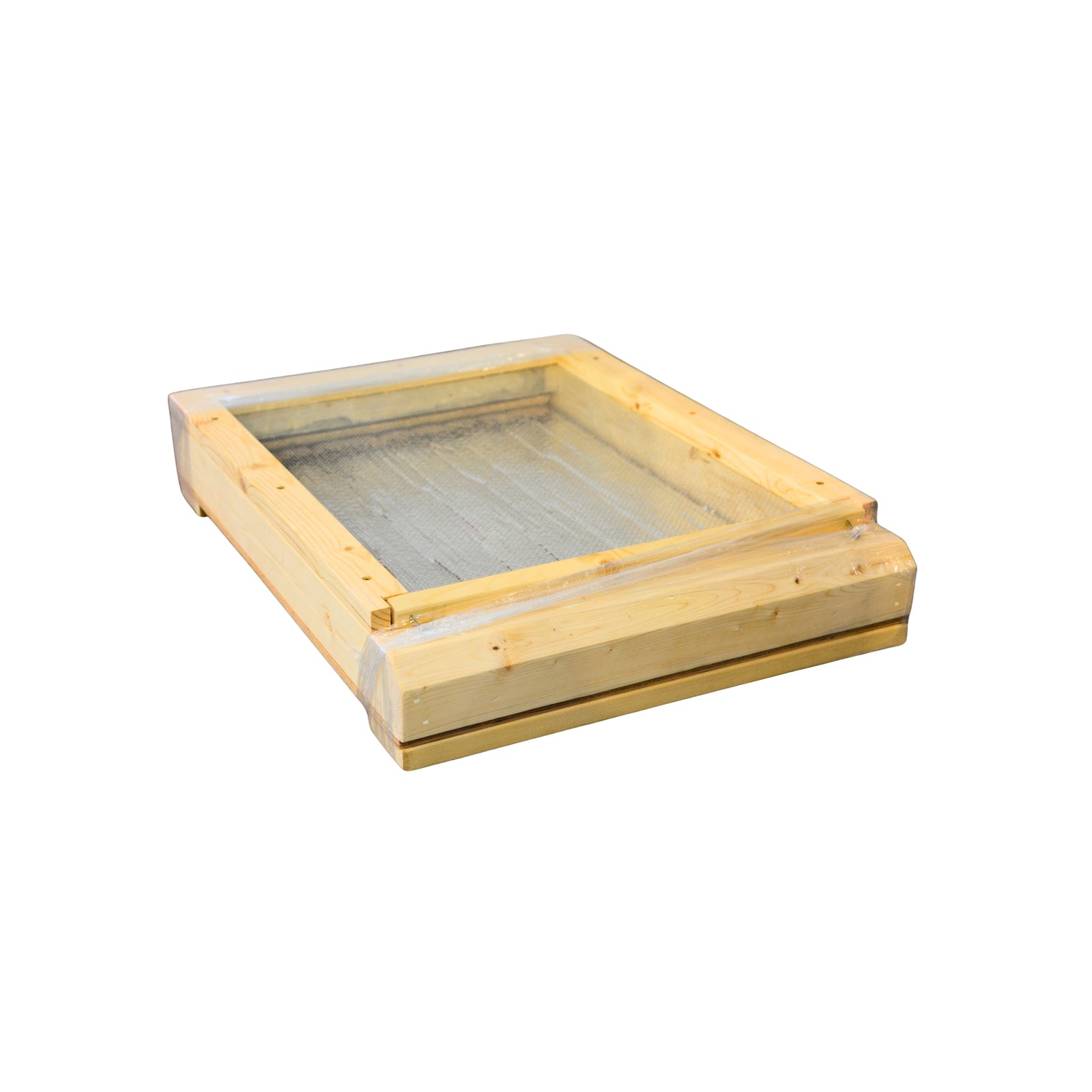 A wooden bottom board for a hive with a screen on a white background