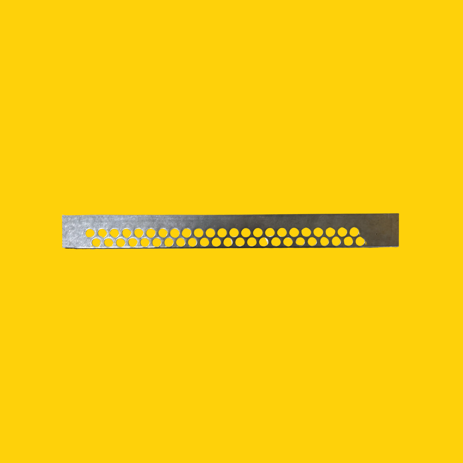 A metal mouse guard on a yellow background