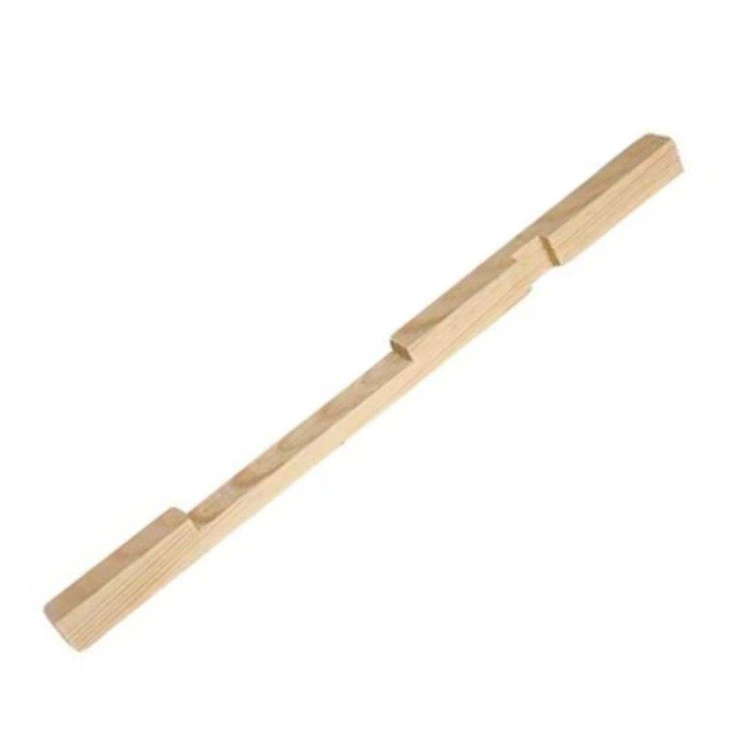 A wooden entrance reducer for a hive, featuring a notched design to regulate the size of the bottom entrance.