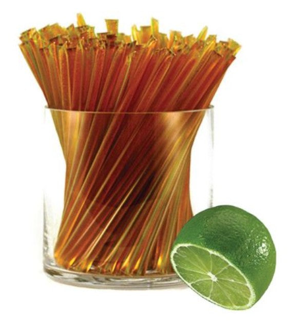 A glass jar of liquid honey stixs, in the flavour lime on a white background.