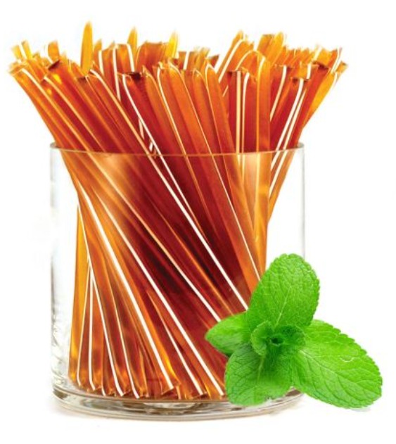 A glass jar of liquid honey stixs, in the flavour mint on a white background.