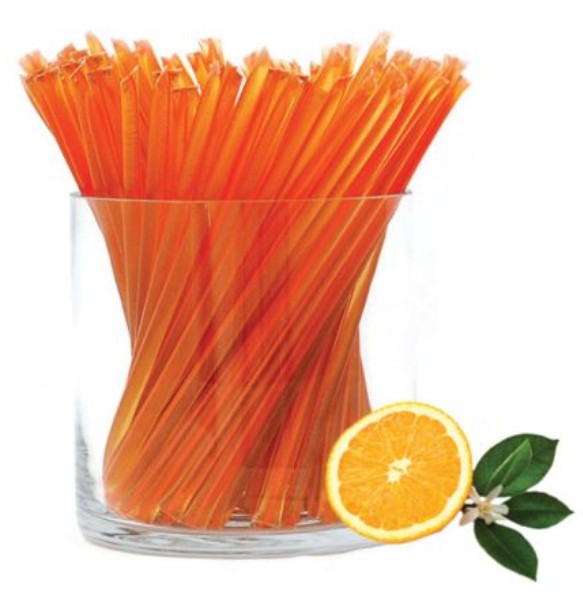 A glass jar of liquid honey stixs, in the flavour orange blossom on a white background.