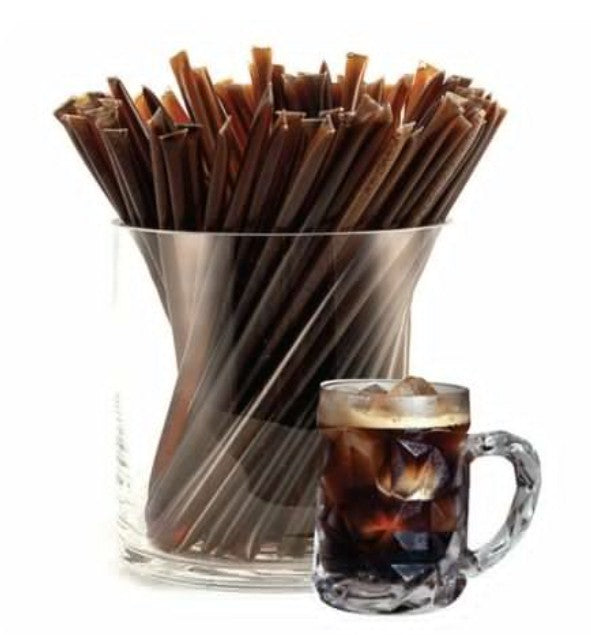A glass jar of liquid honey stixs, in the flavour root beer on a white background.