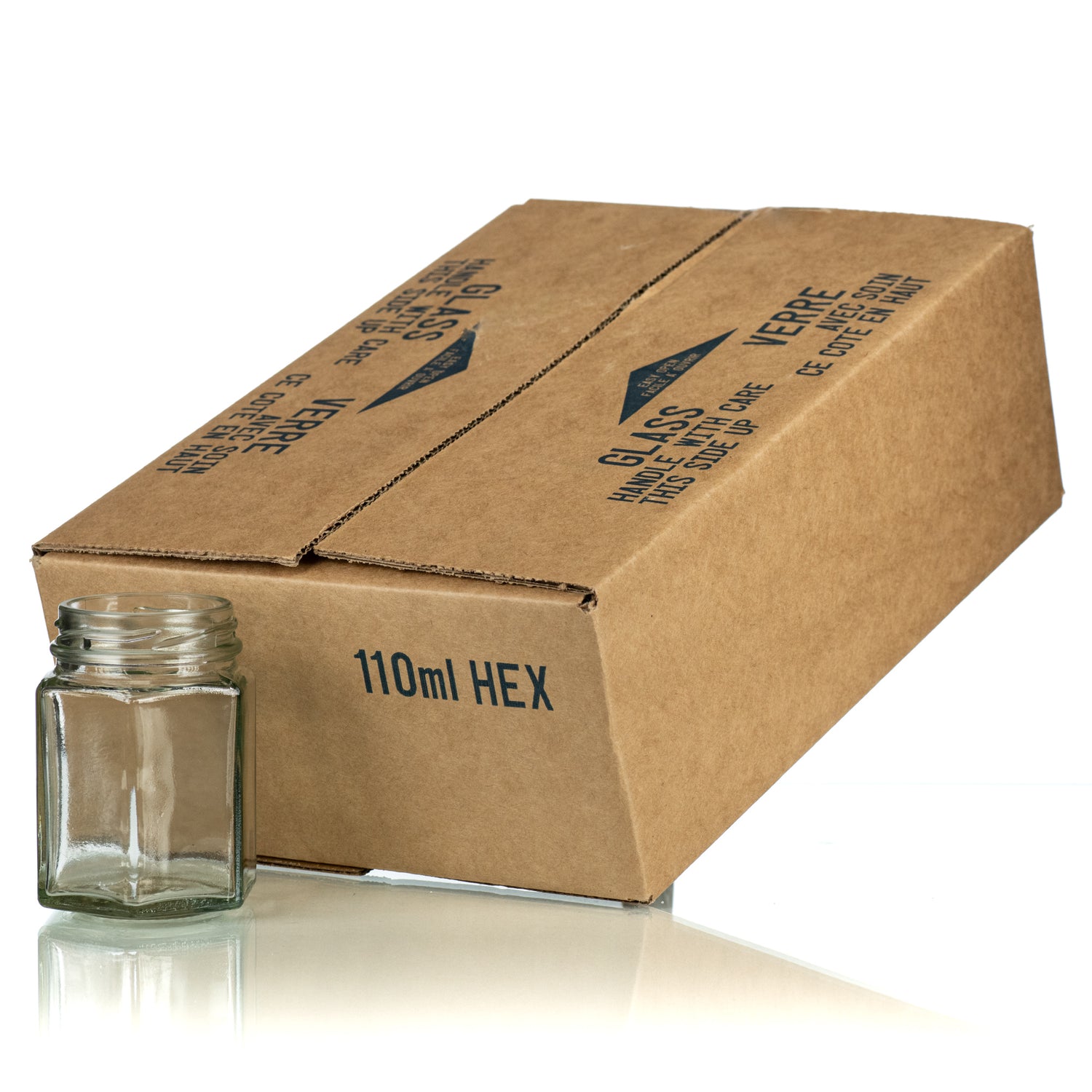 A case of 12 clear glass 110mL hexagonal jars, packaged in a cardboard box.