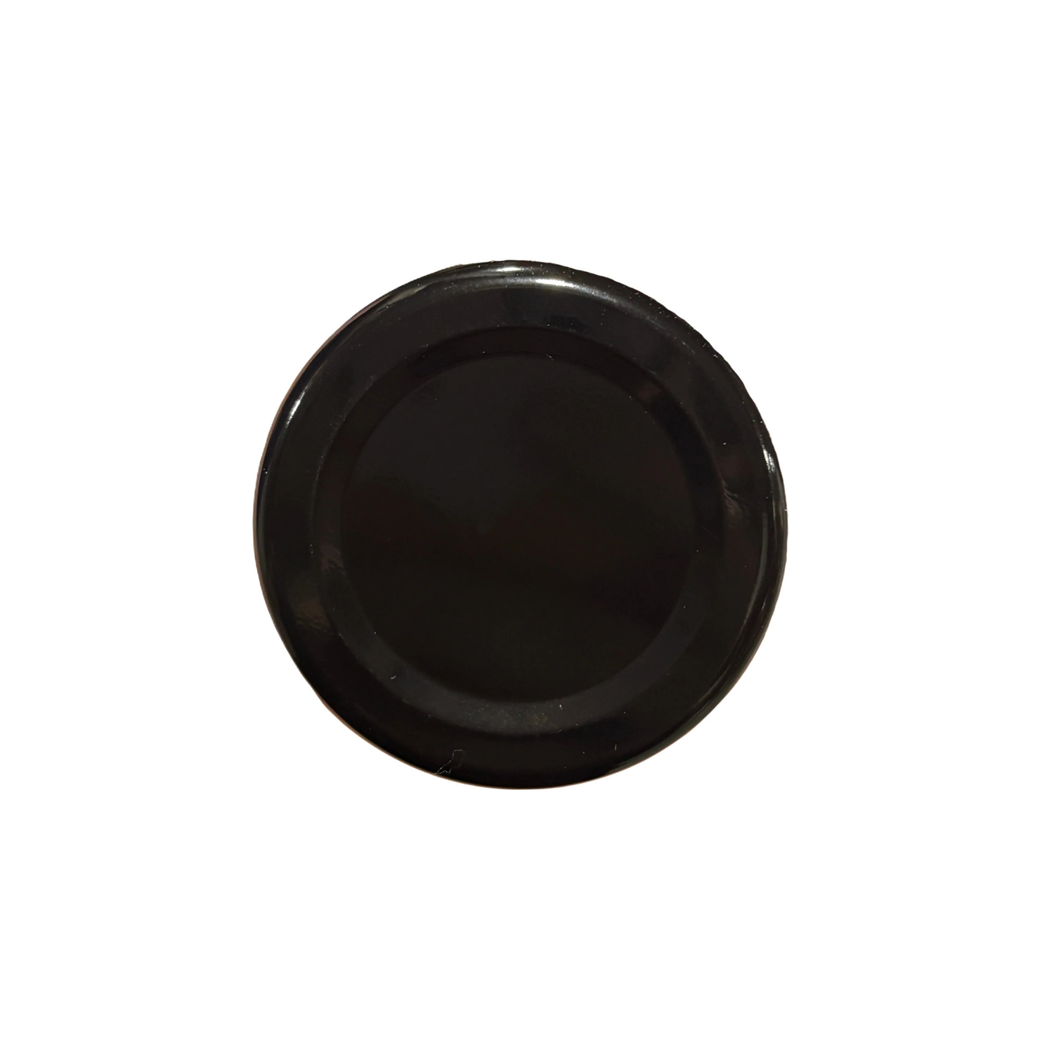 Black metal lid on a white background