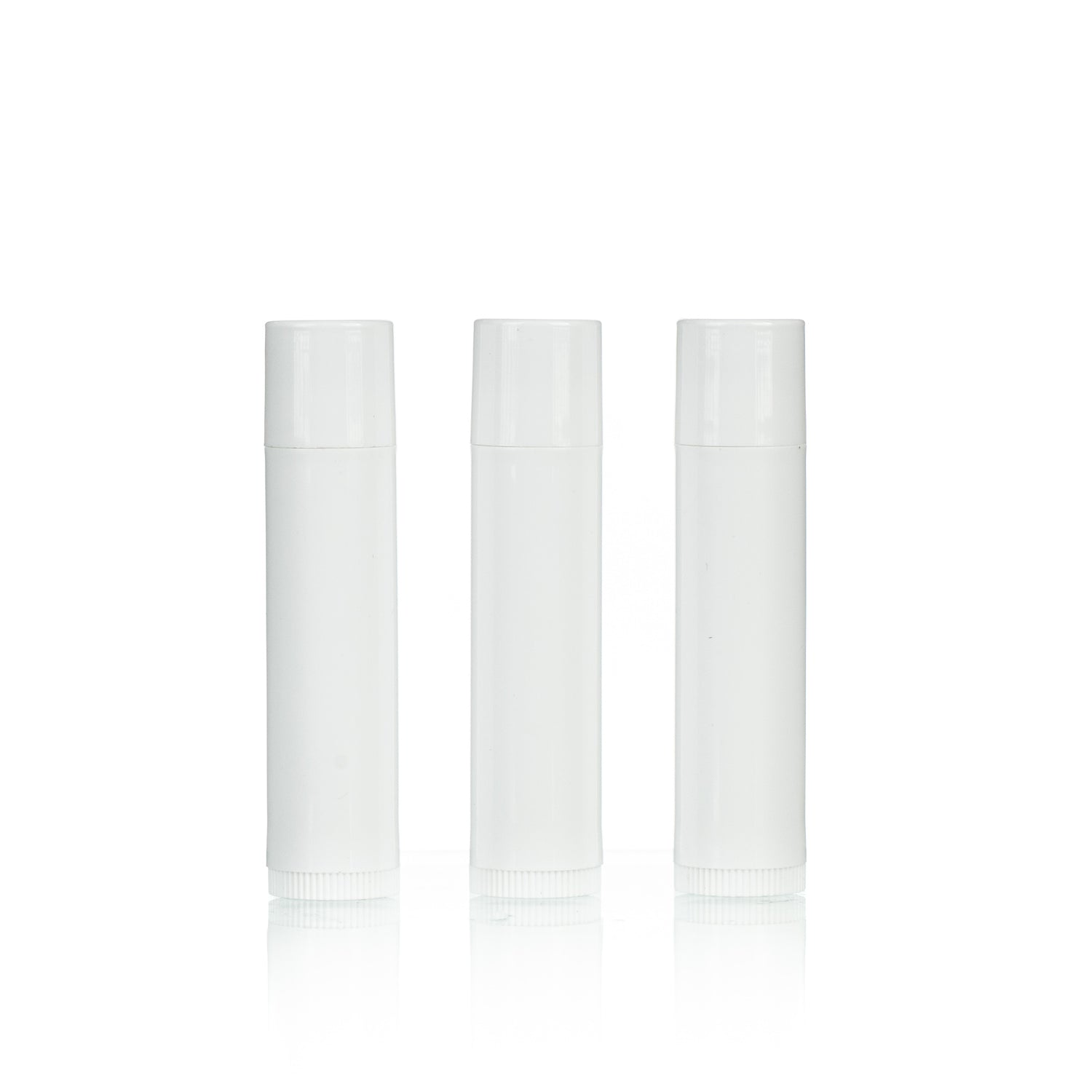 Three white, cylindrical lip balm containers on a white background