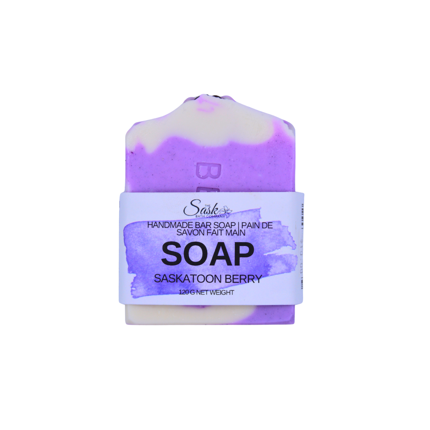 A handmade bar of soap labeled 'Saskatoon Berry', featuring a purple and cream marbled design with a white paper band around the middle on a white background