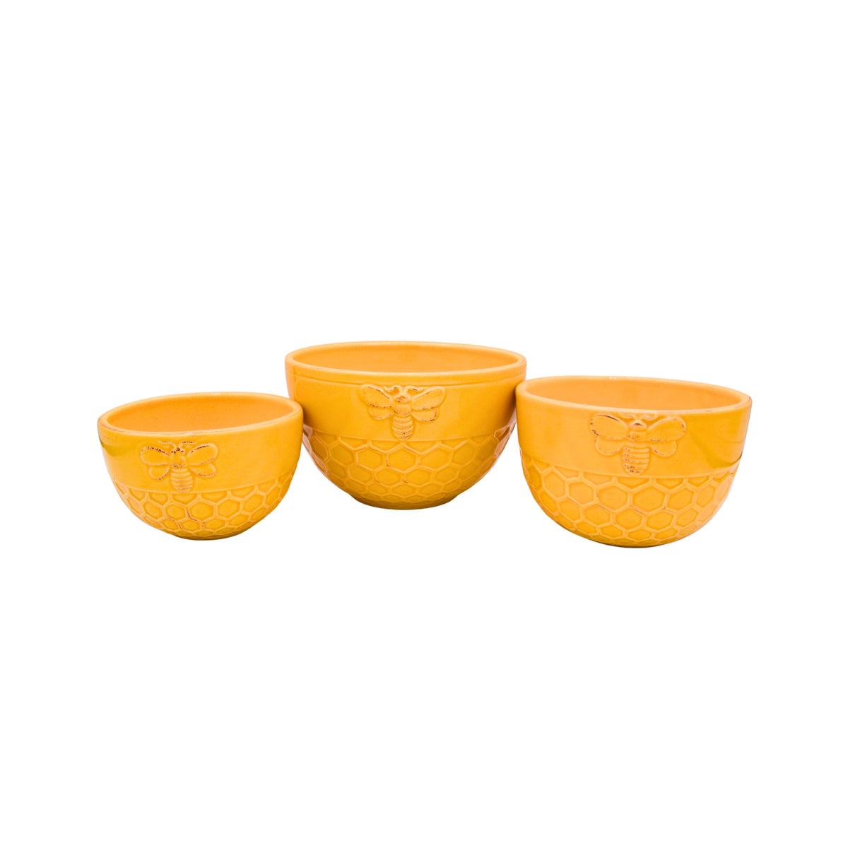 Three yellow ceramic bowls with embossed bee and honeycomb designs, arranged in ascending size on a plain white background.