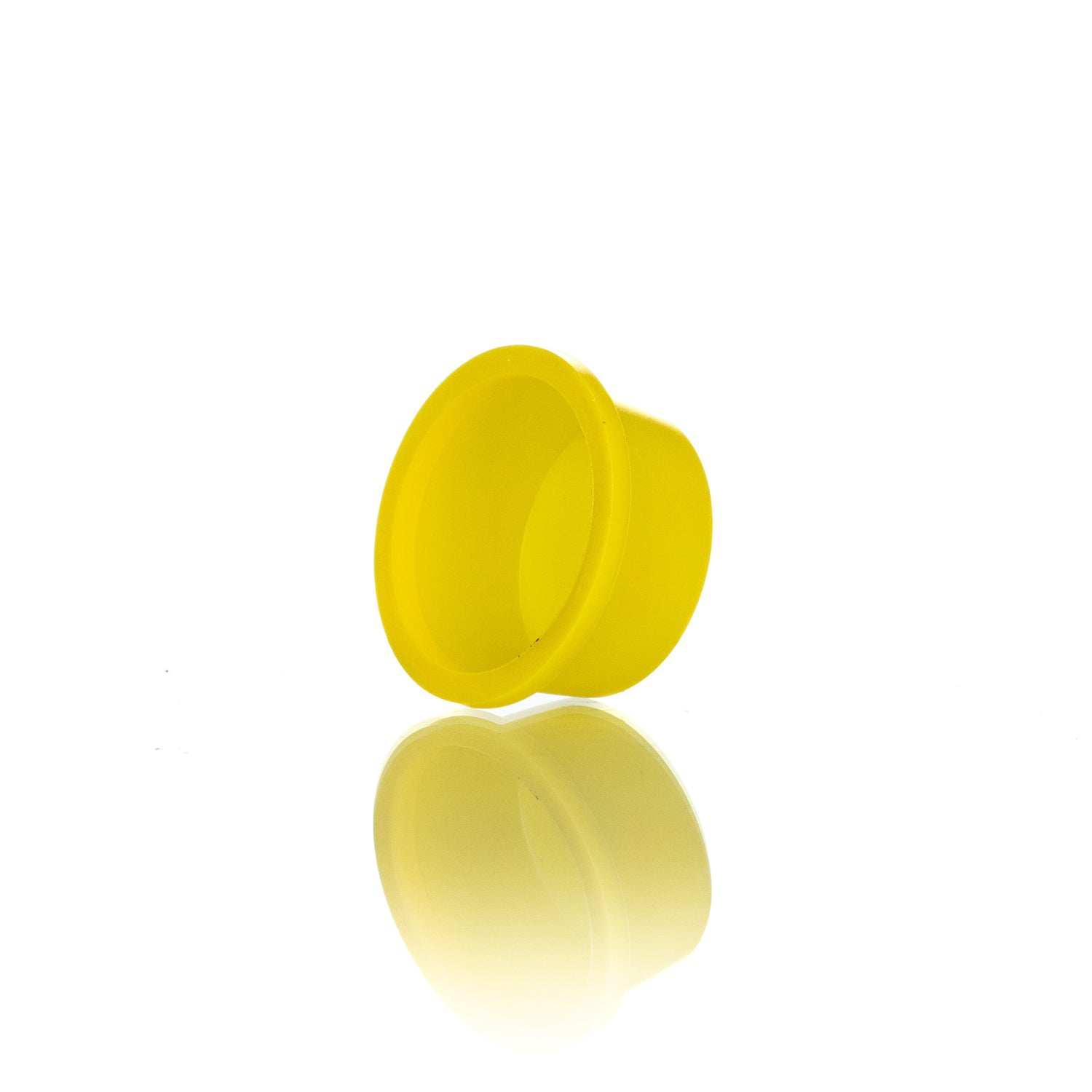 A single yellow plastic plug designed for use in beekeeping.