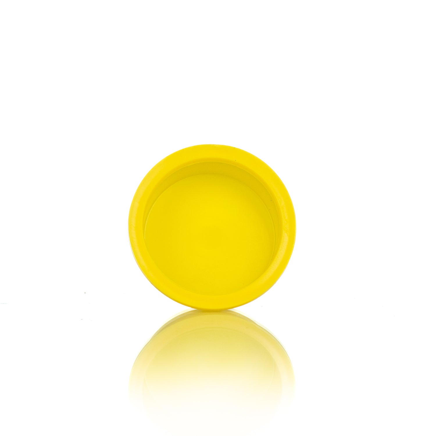 A single yellow plastic plug designed for use in beekeeping.
