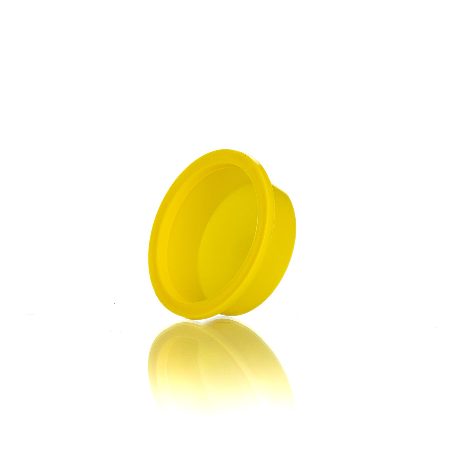 A side view of a single yellow plastic plug designed for use in beekeeping.
