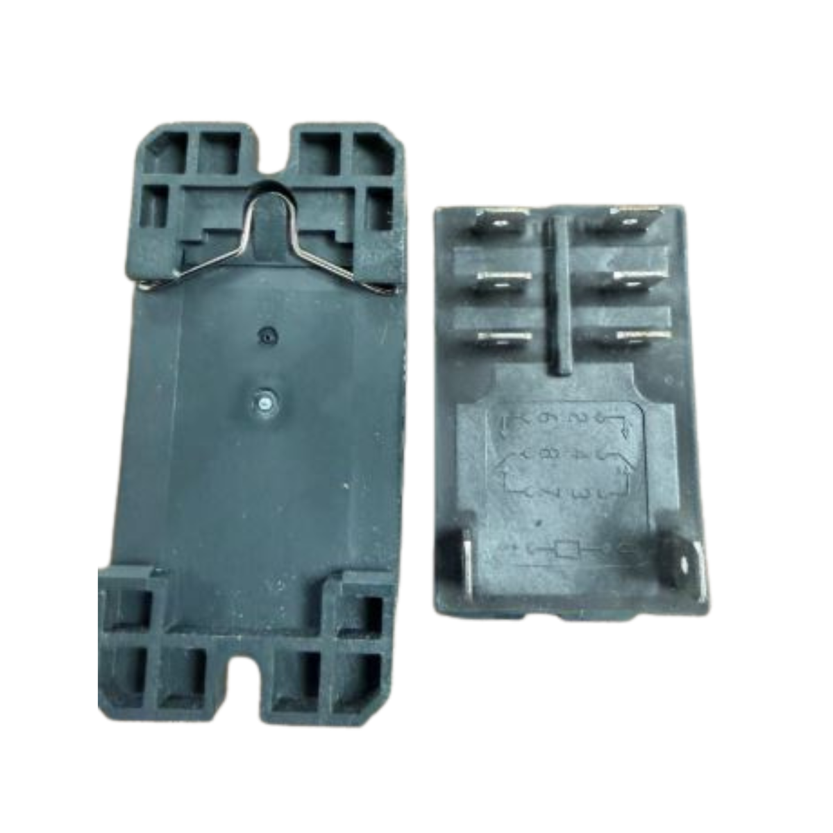 Two gray plastic components on a white surface
