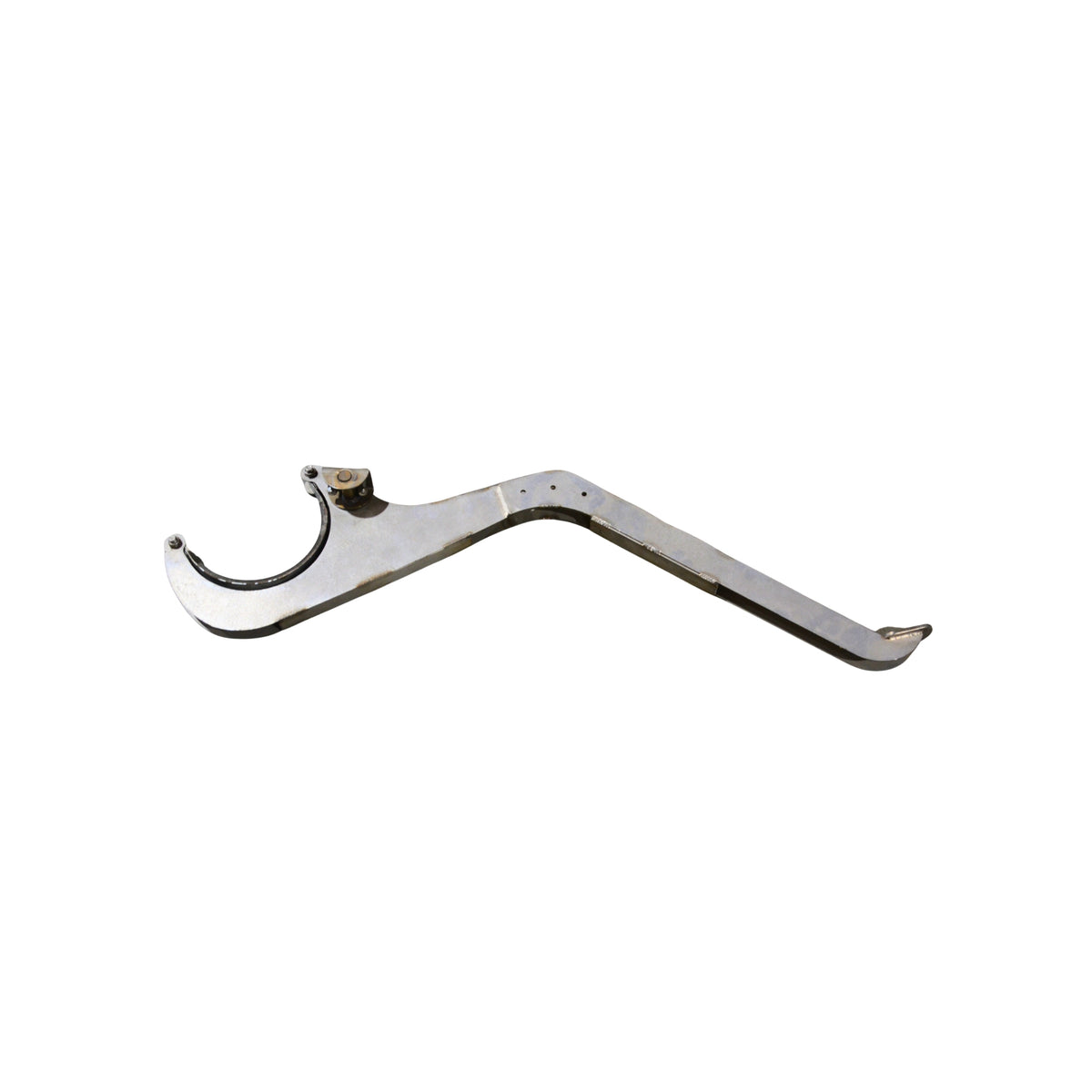 A metal brake pedal assembly on a white background