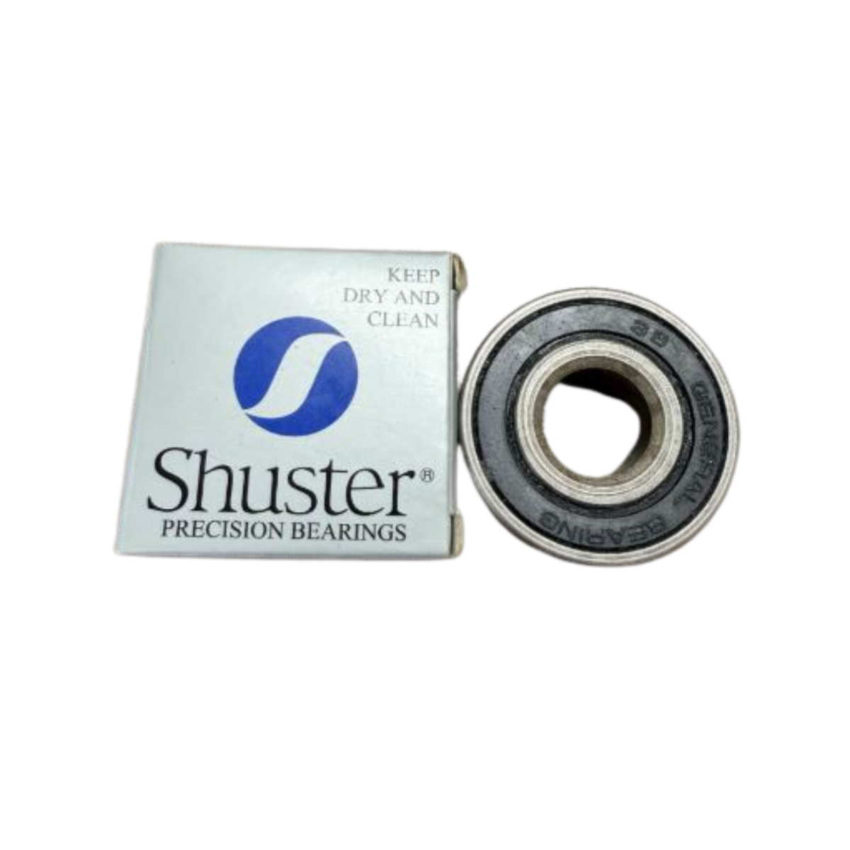 Shuster precision bearing and its packaging on a white surface