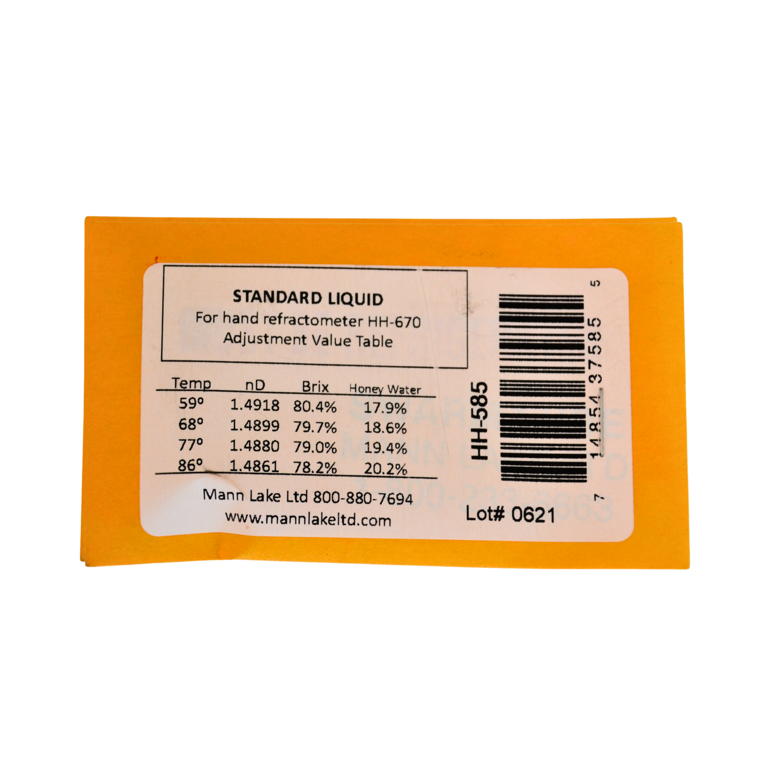 A small, light brown manila envelope with a white label containing the refractometer calibration fluid on a white background