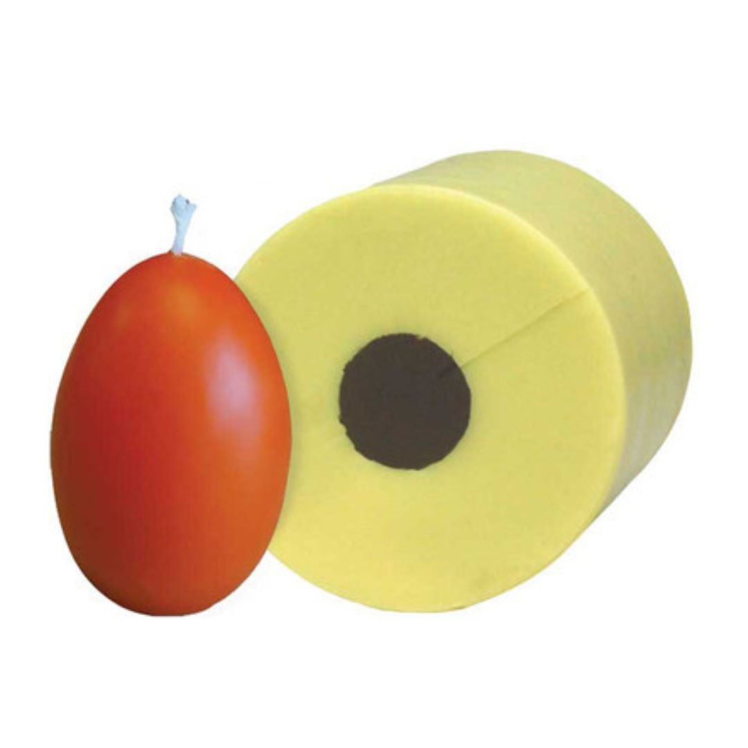 A yellow candle mold alongside an orange candle shaped like an egg on a white background