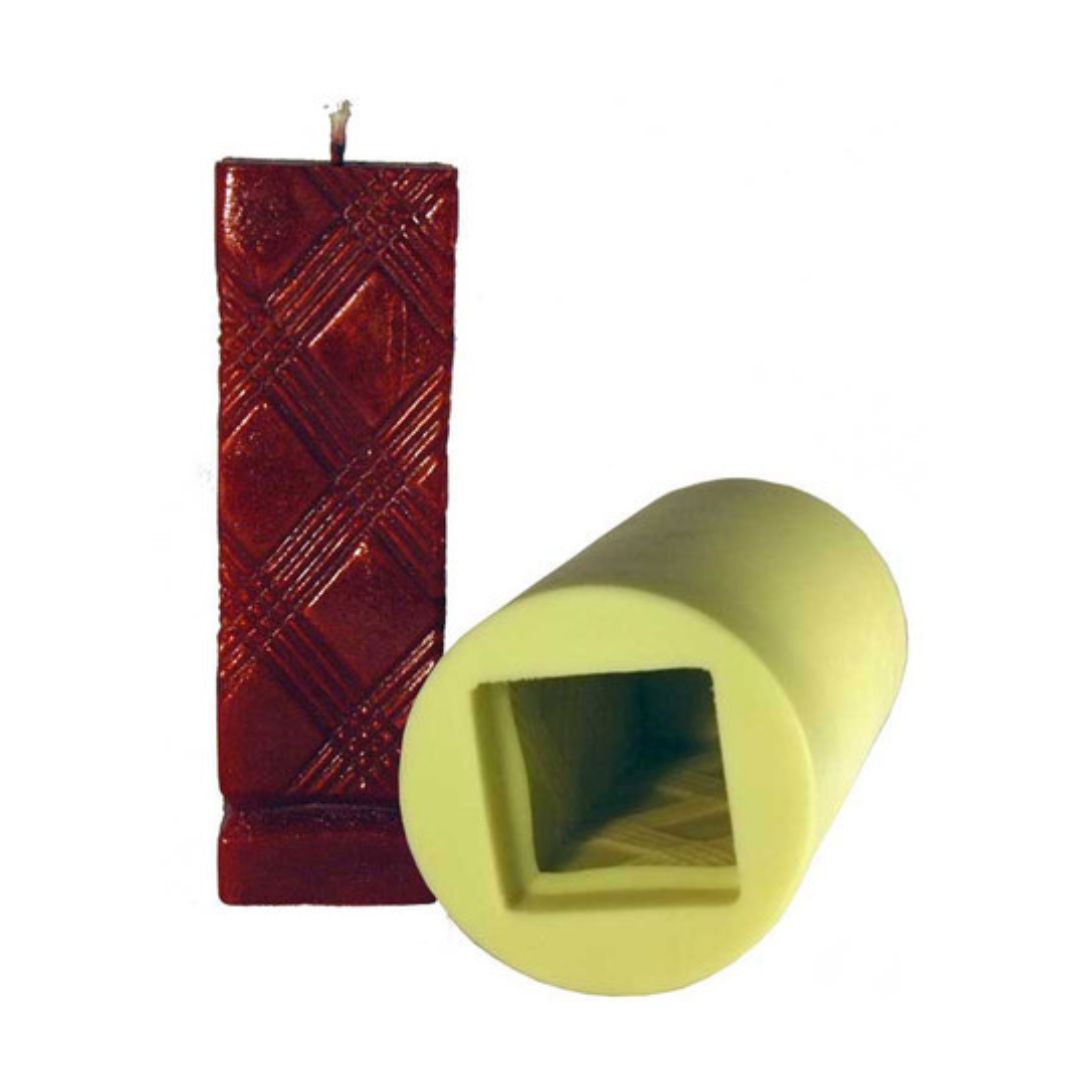 A textured pillar candle mold alongside a candle with a cross-hatched pattern exterior on a white background