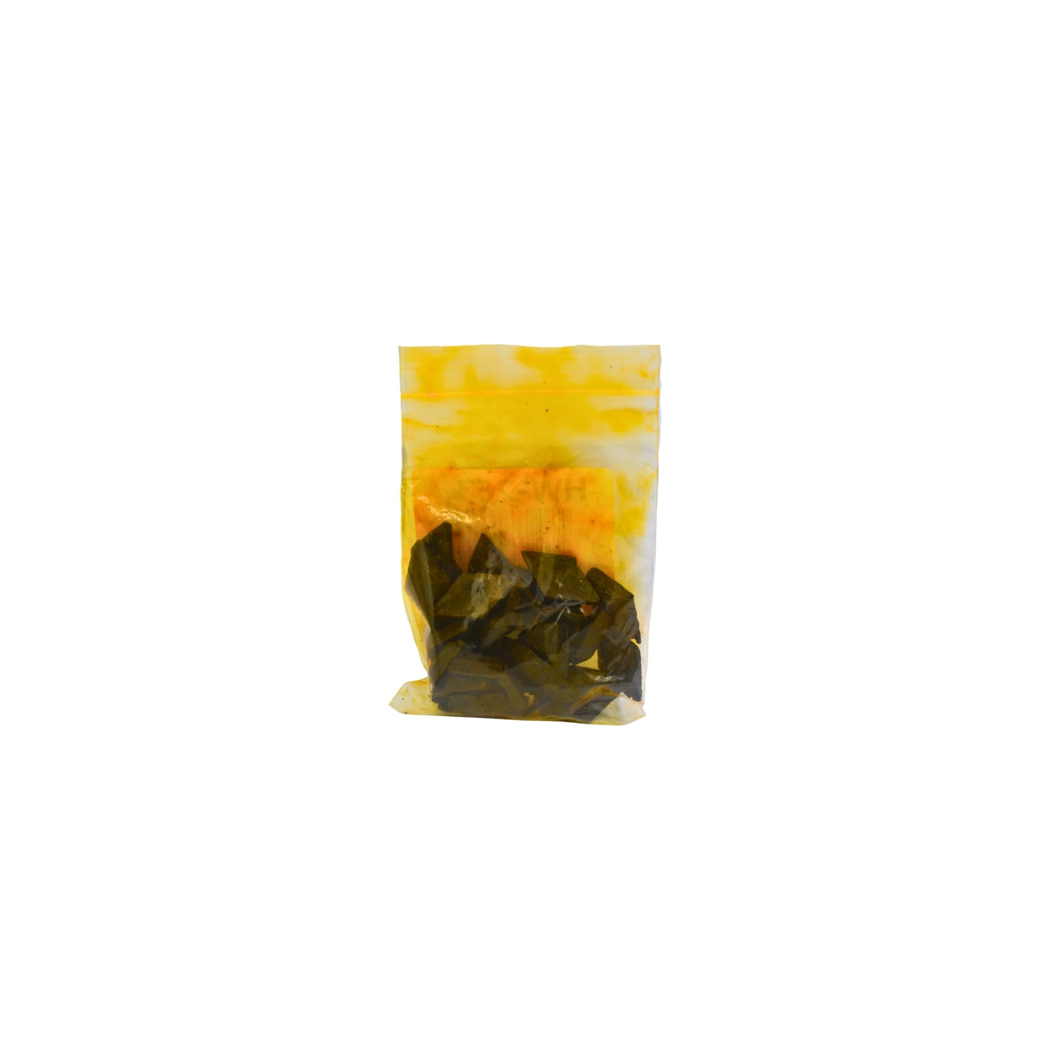 A small clear plastic pouch containing black dye chips shown on a plain white background.