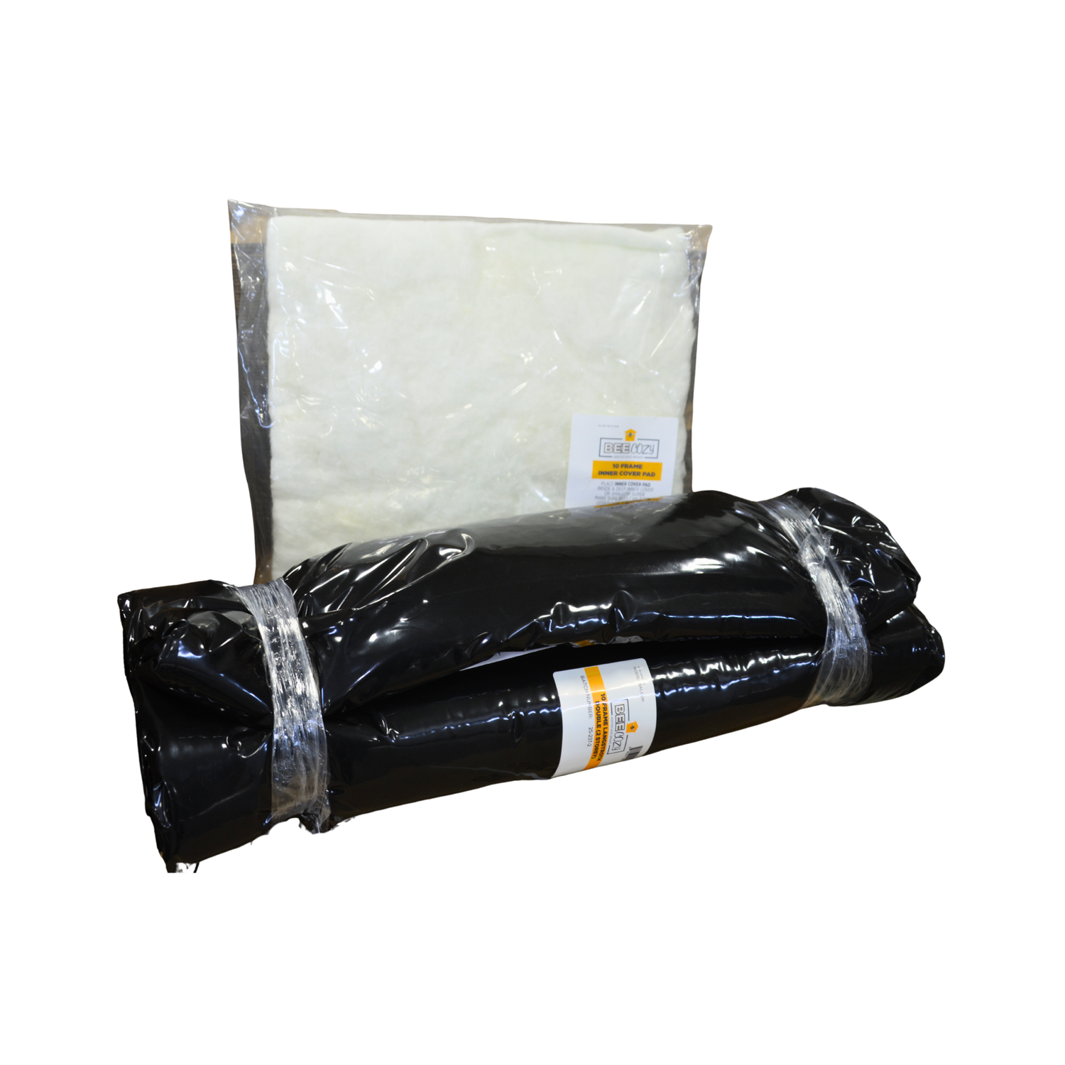 A black rolled fabric or mat-like product wrapped in clear plastic with a white label, placed in front of a larger upright clear plastic package containing a white material, on a plain white background.