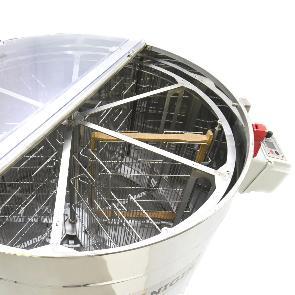 A close up pf a KONIGIN motorized 8 frame honey extractor with the lid propped open to expose the interior on a white background