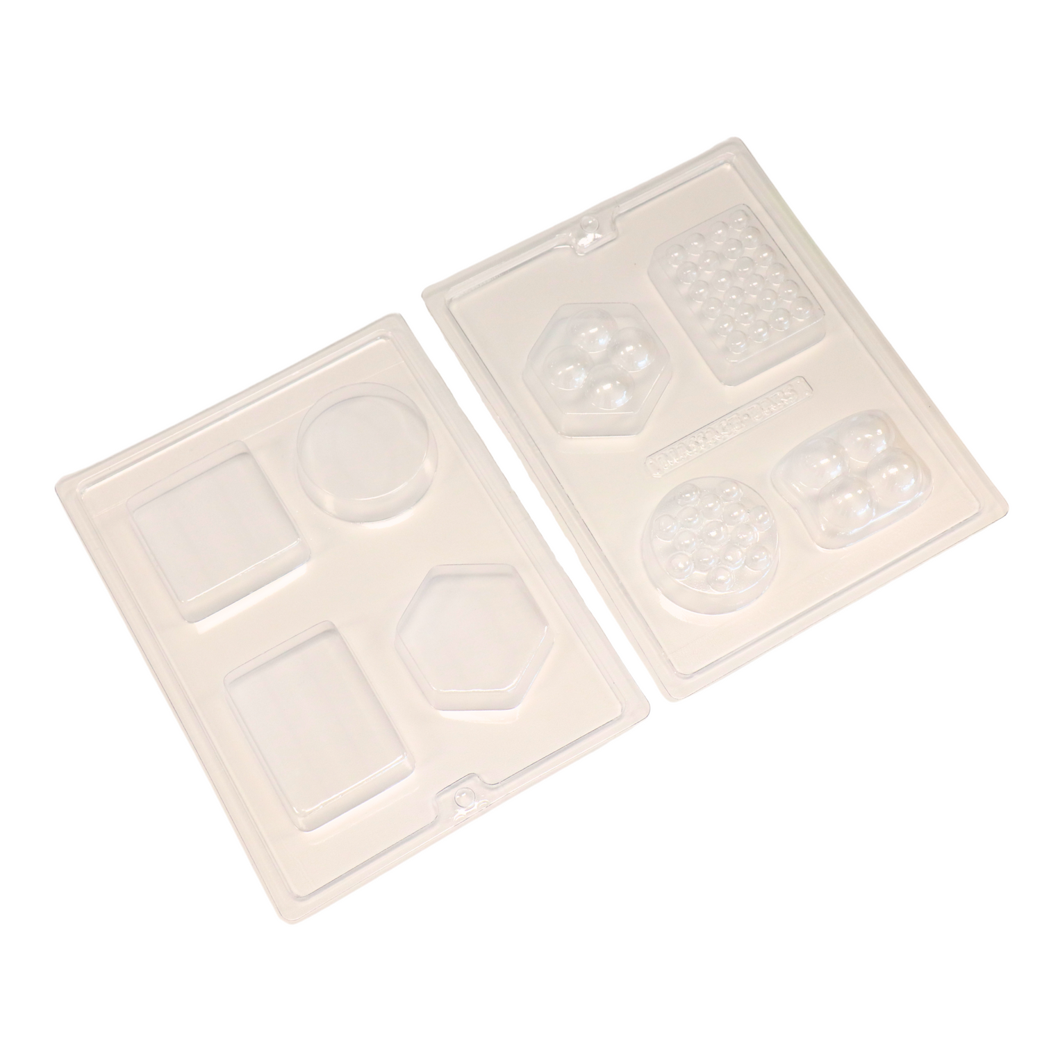 2 plastic sheets of soap molds on a white background