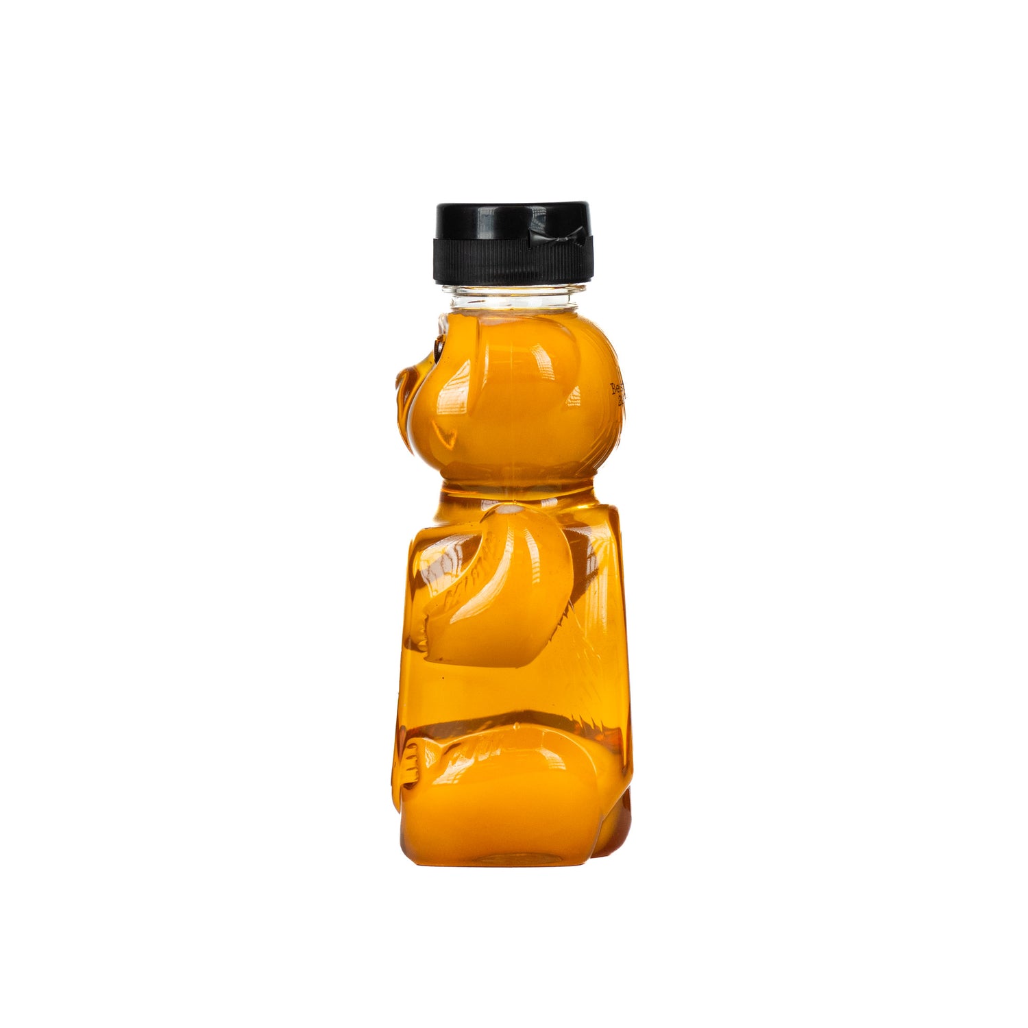 A 375-gram BeeMaid bottle in the shape of a bear containing pure liquid honey, on a white background