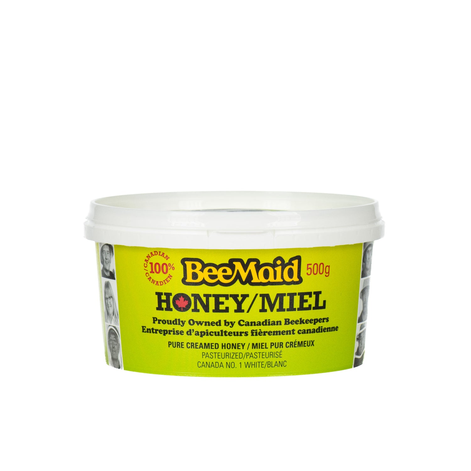 A 500-gram plastic green tub of BeeMaid creamed honey on a white background.