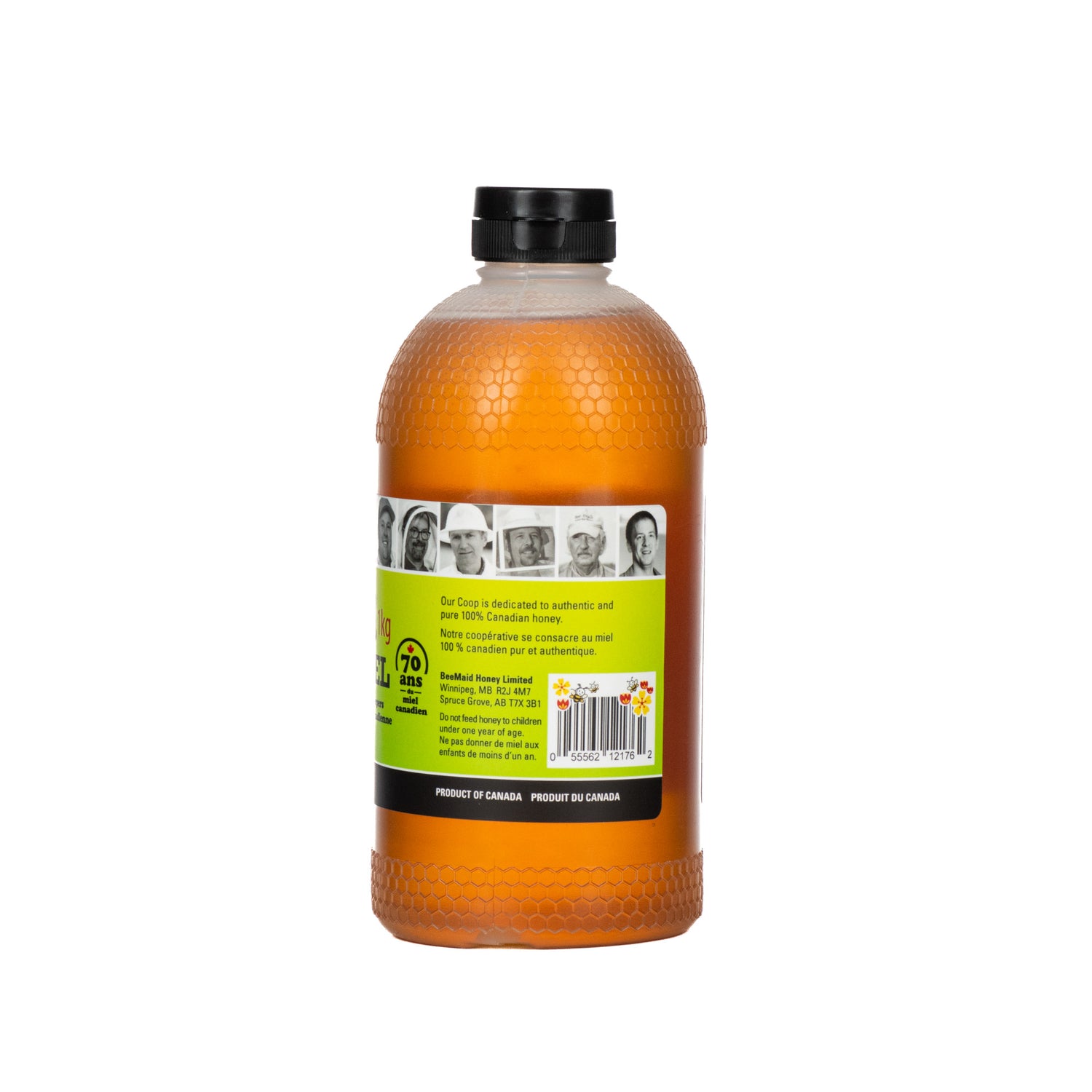 A 1-kilogram plastic bottle of BeeMaid liquid honey on a white background