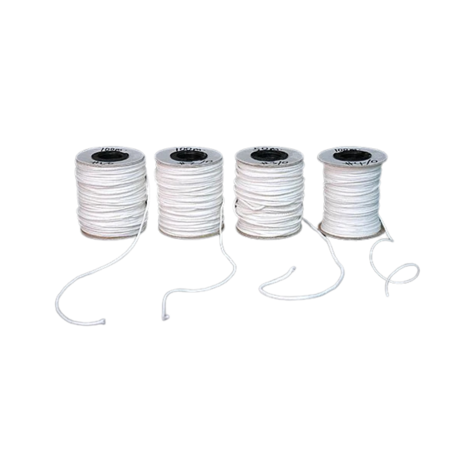 Four spools of white candle wick on a white background