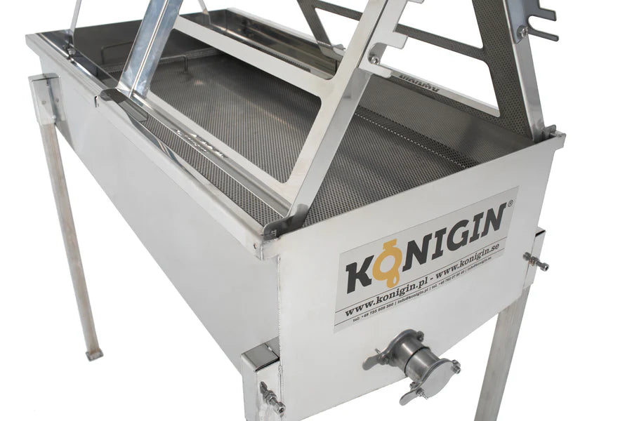 A close up of a KONIGIN brand uncapping table made of stainless steel, designed for honey processing, featuring two work stands and frame holders.