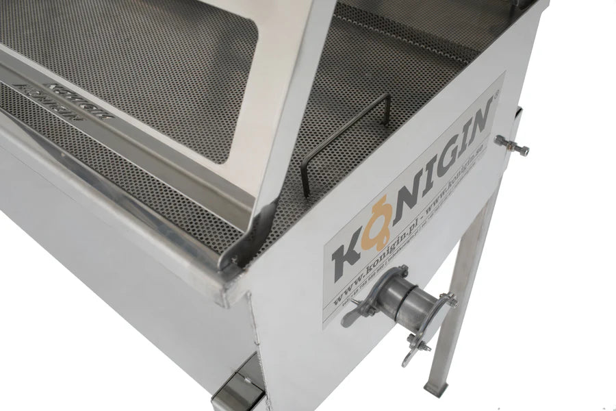 A close up of a KONIGIN brand uncapping table made of stainless steel, designed for honey processing, featuring two work stands and frame holders.