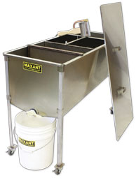 A mobile un-capping table made of stainless steel, including a removable capping basket, a lid, and optional uncapping plane, on removable legs with wheels, displayed on a white background
