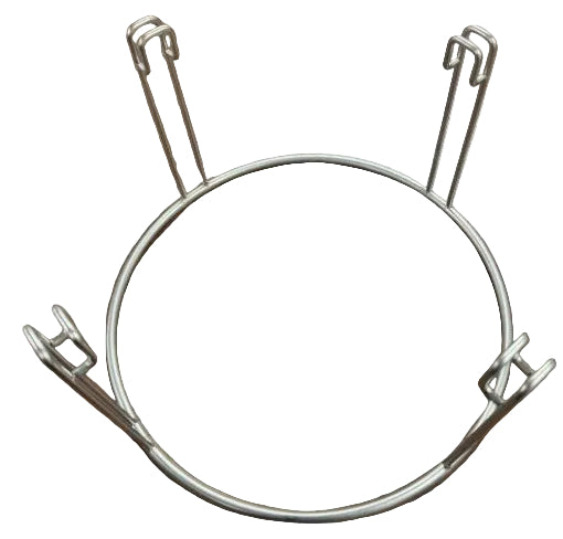 A circular metal holder or stand made from silver wire. The ring has four vertical wire supports spaced evenly around the circle, each with a bent hook-like end. The stand is placed on a wooden surface.