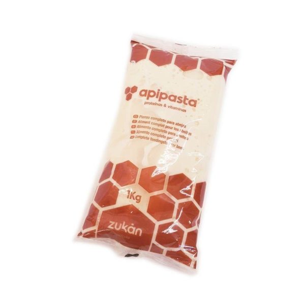 A 1 kg plastic pouch of Apipasta bee feed, featuring a red honeycomb design and labeled with “apipasta – proteins & vitamins” and the Zukán brand logo.
